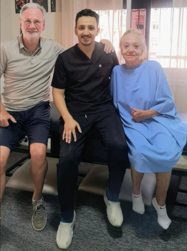 Ayyoub Ouchen with an elderly couple after successful chiropractic treatment in Agadir